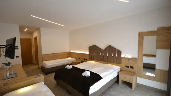 Twin bedroom with extra bed