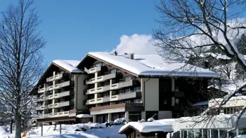 ChatGPT said: Hotel Sunstar Grindelwald stands elegantly blanketed in snow, with its classic alpine architecture set against a backdrop of Grindelwald