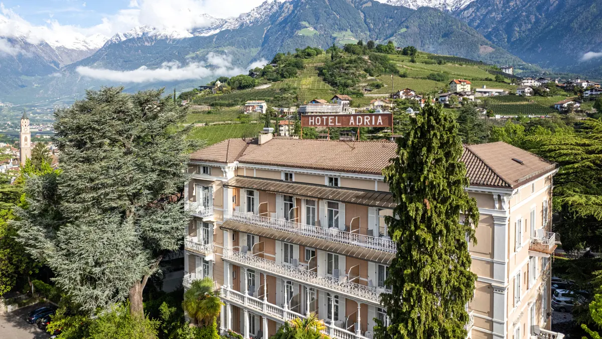 Hotel Adria Merano Exterior With Mountain Backdrop